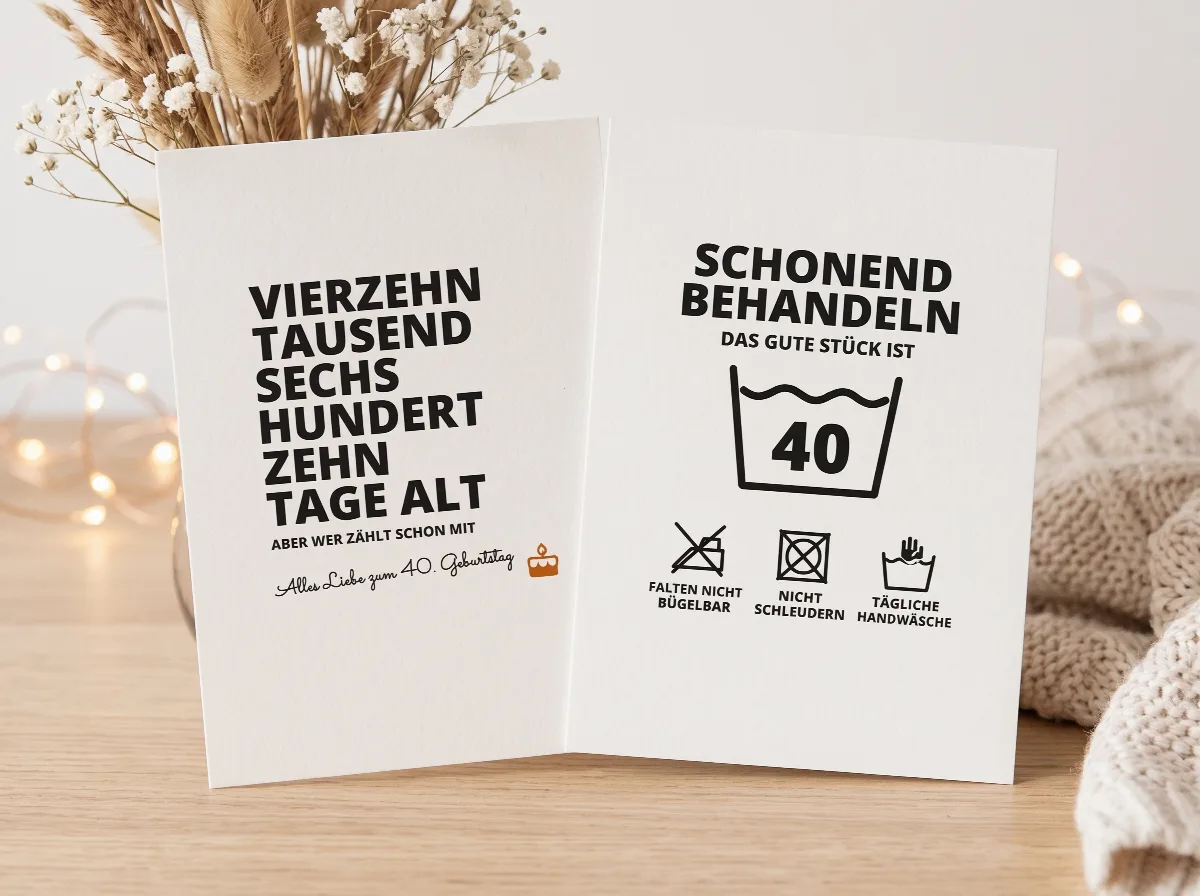 Zwei Geburtstagskarten: Vierzehn tausend sechs hundert zehn Tage alt und Waschetikett Schonend behandeln, das gute Stück ist 40